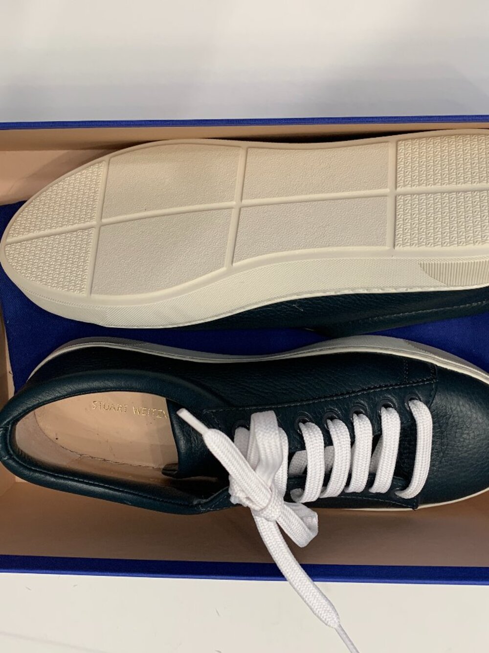 Stuart Weitzman sneaker with a lace-up design